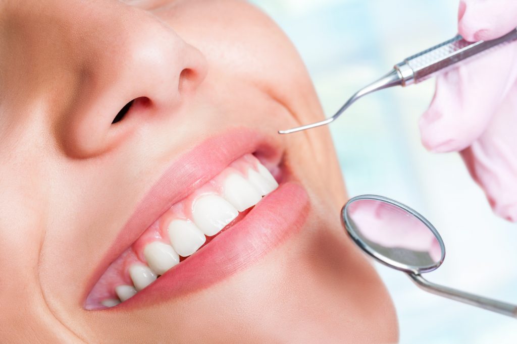 Human Teeth with Hatchet and Mouth Mirror