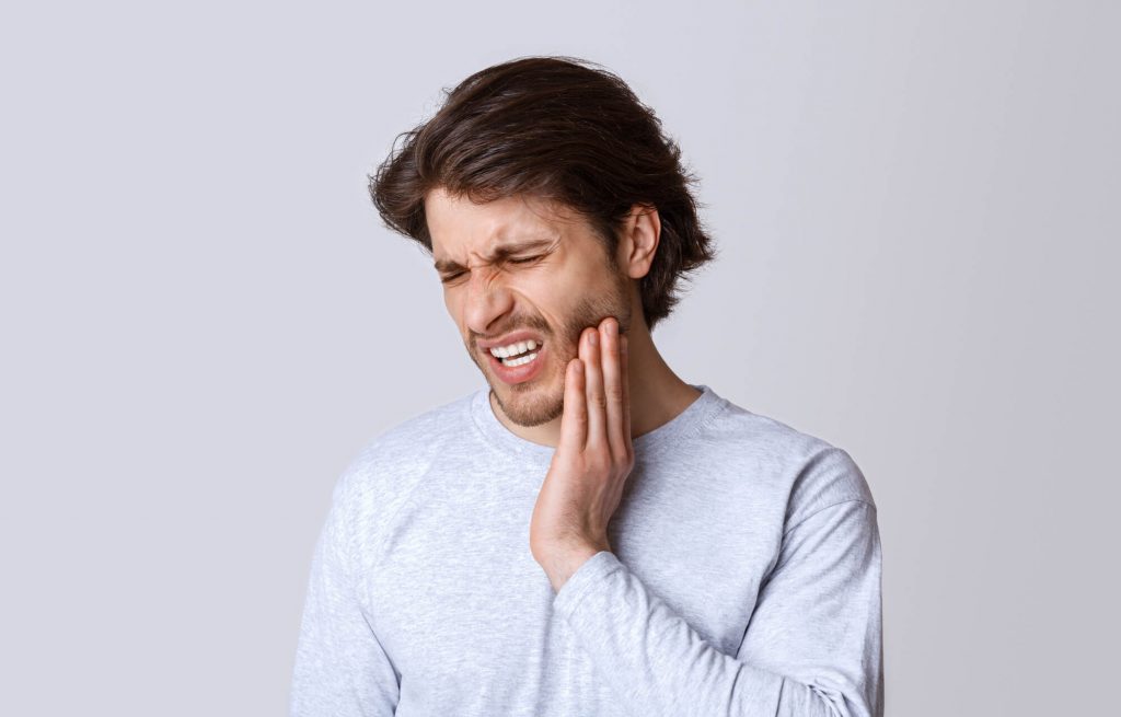 man needs emergency dentist in medford
