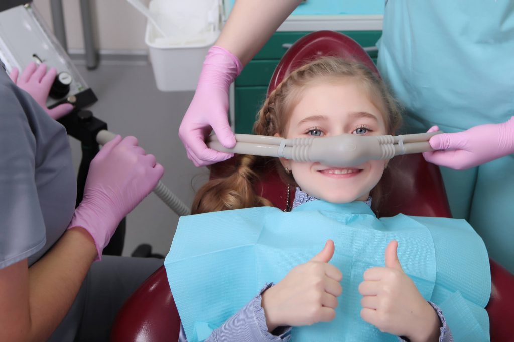 Girl undergoing sedation dentisty in medford