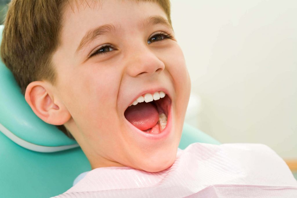 A little boy receives treatment from an expert in children's dental in Medford
