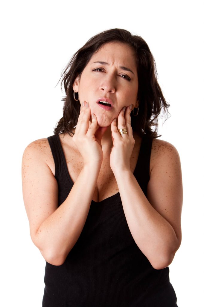 woman needing TMJ treatment in park falls wi