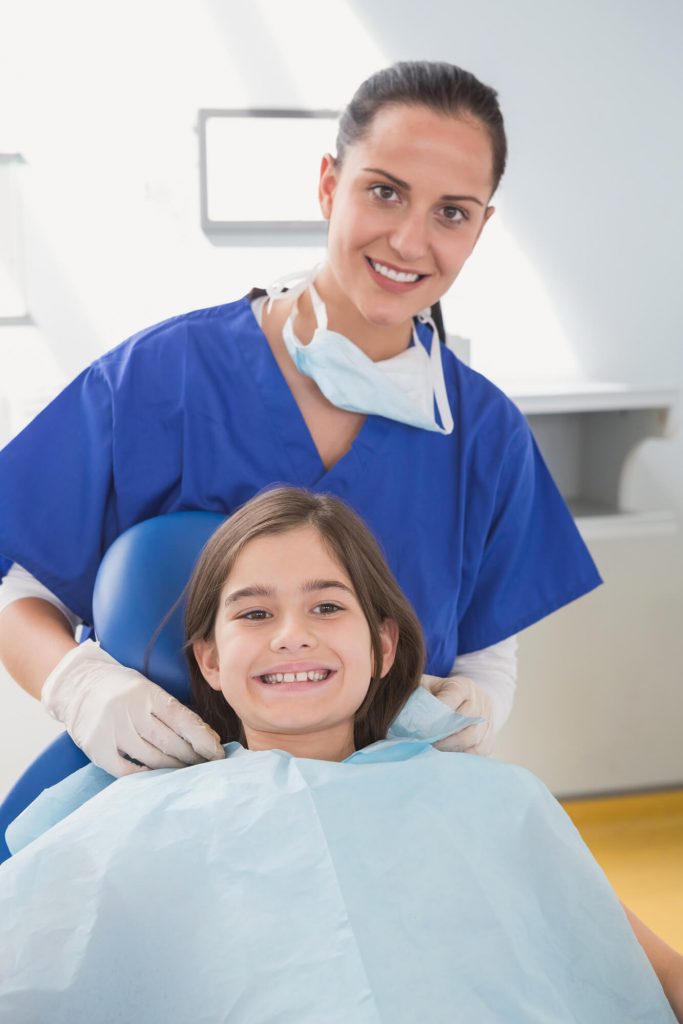 pediatric dentist medford with a smiling kid