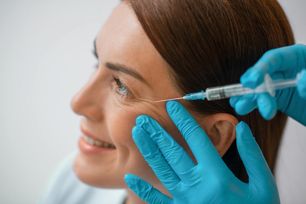 Woman smiles as she gets Botox®& Xeomin® Park Falls