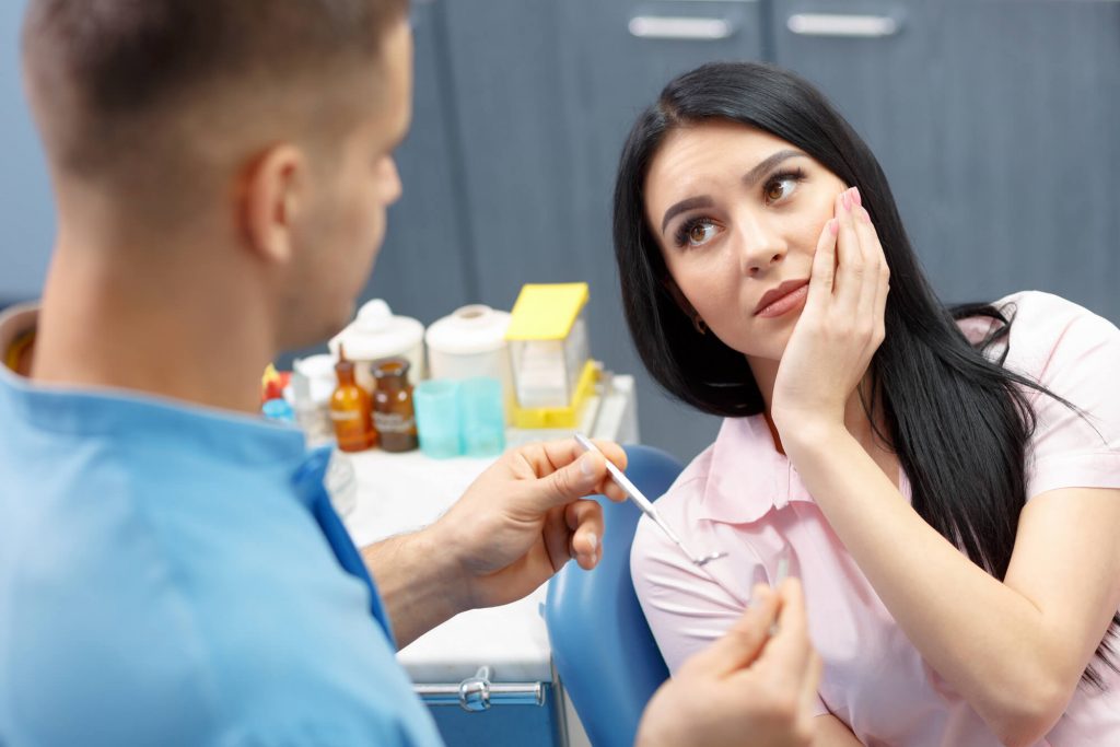 root canal dentist in Park Falls talking to a patient