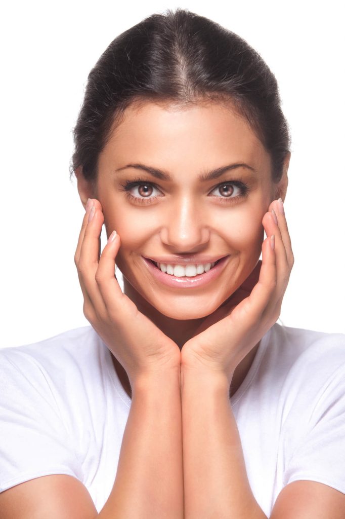 woman smiling after teeth whitening in medford