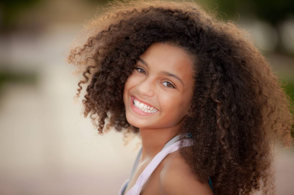 kid smiles at a Medford dentist