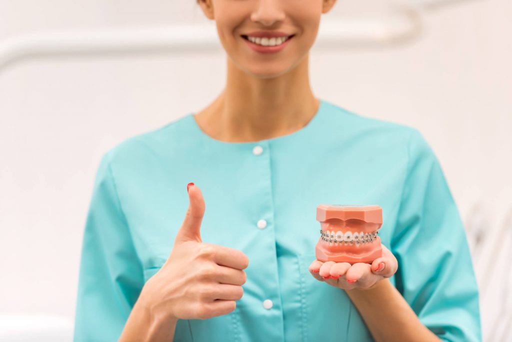 an expert in orthodontic treatments in park falls giving a thumbs up
