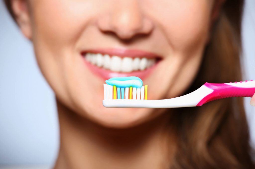 dentist in Ladysmith, WI with toothbrush and toothpaste