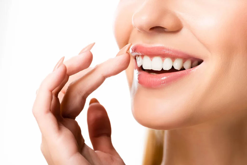 close up of a woman's smile after getting porcelain veneers in medford