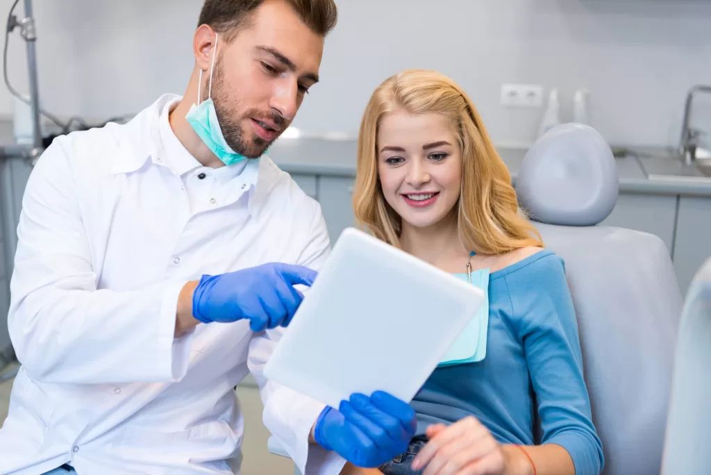 patient and doctor checking xrays at a dentist office medford
