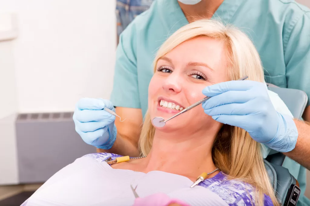 woman smiles while dentist is about to perform a ladysmith dental check up